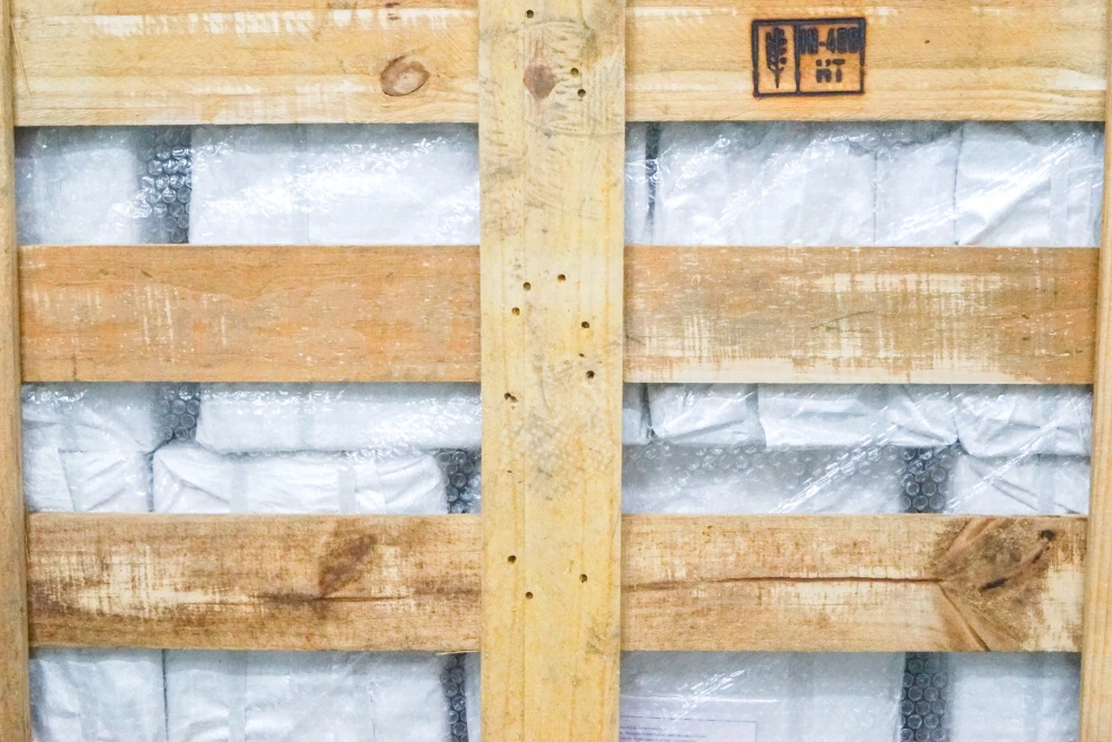 Heat treatment for wooden packaging materials